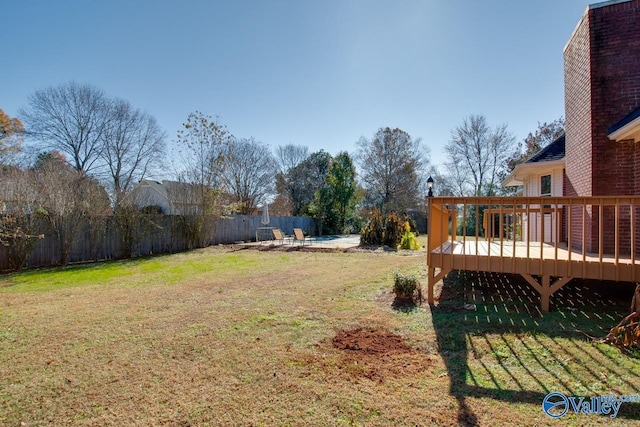 view of yard with a patio and a wooden deck