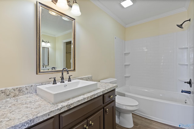 bathroom with toilet, wood finished floors, shower / bathing tub combination, crown molding, and vanity