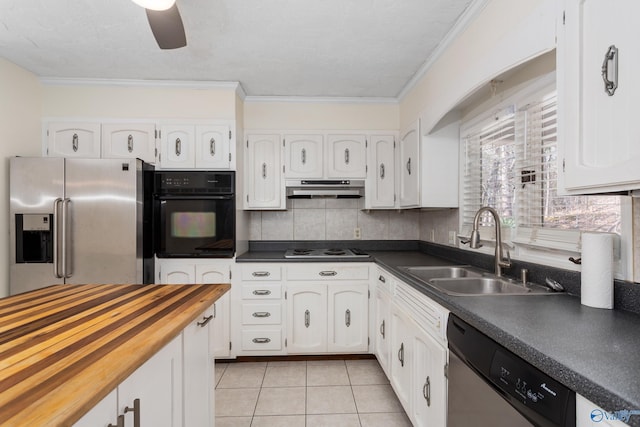 kitchen with sink, ceiling fan, light tile patterned floors, appliances with stainless steel finishes, and white cabinetry