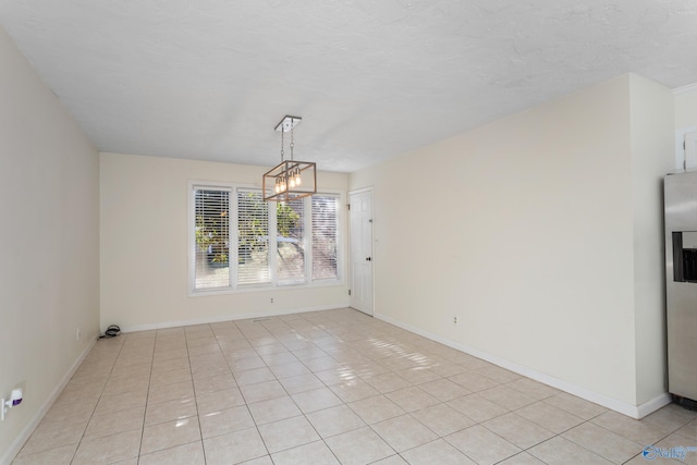 unfurnished dining area featuring a notable chandelier and light tile patterned flooring