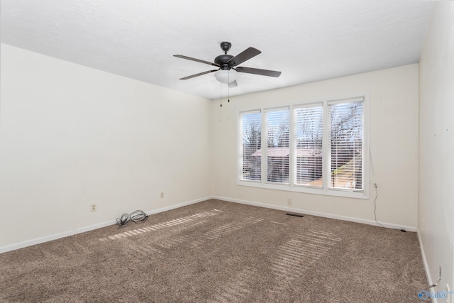 carpeted empty room with ceiling fan