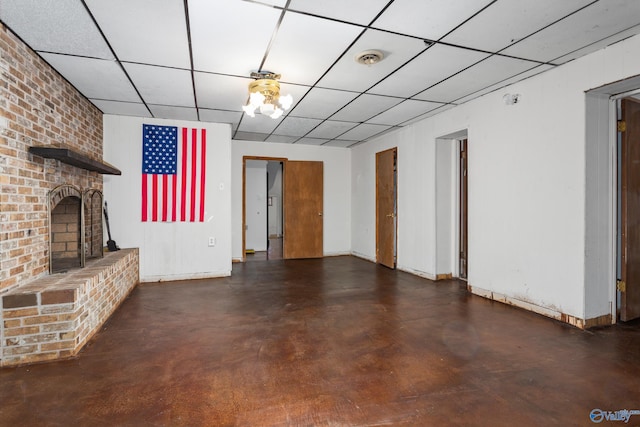 unfurnished living room with a brick fireplace