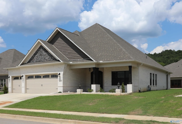 view of front of home featuring a garage and a front lawn