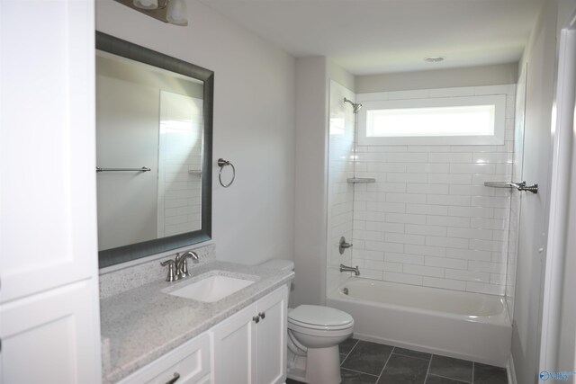 full bathroom with tiled shower / bath combo, vanity, tile patterned floors, and toilet