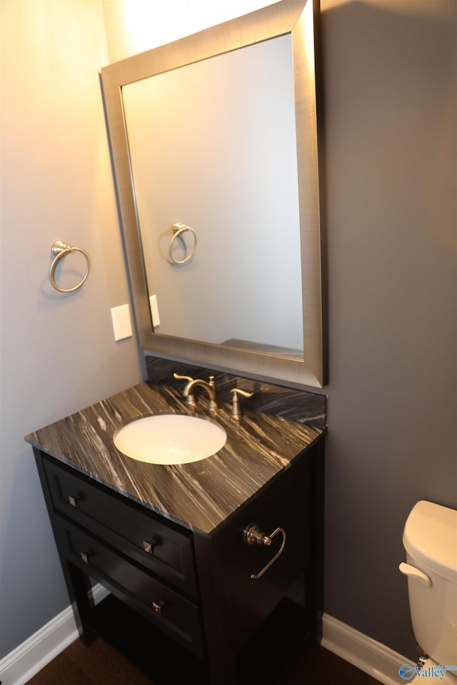 bathroom with vanity and toilet