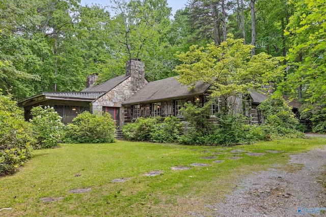LOT1 Moon Lake Rd, Mentone, AL 35984 - view of front of home featuring stone siding, a front lawn, and a chimney