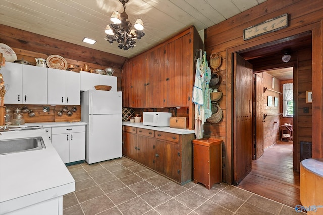 LOT1 Moon Lake Rd, Mentone, AL 35984 - kitchen featuring white appliances, wooden walls, light countertops, a chandelier, and decorative backsplash