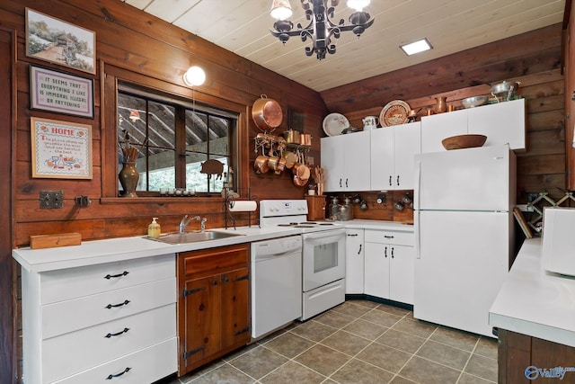 LOT1 Moon Lake Rd, Mentone, AL 35984 - kitchen with white appliances, wooden walls, light countertops, dark tile patterned floors, and white cabinetry