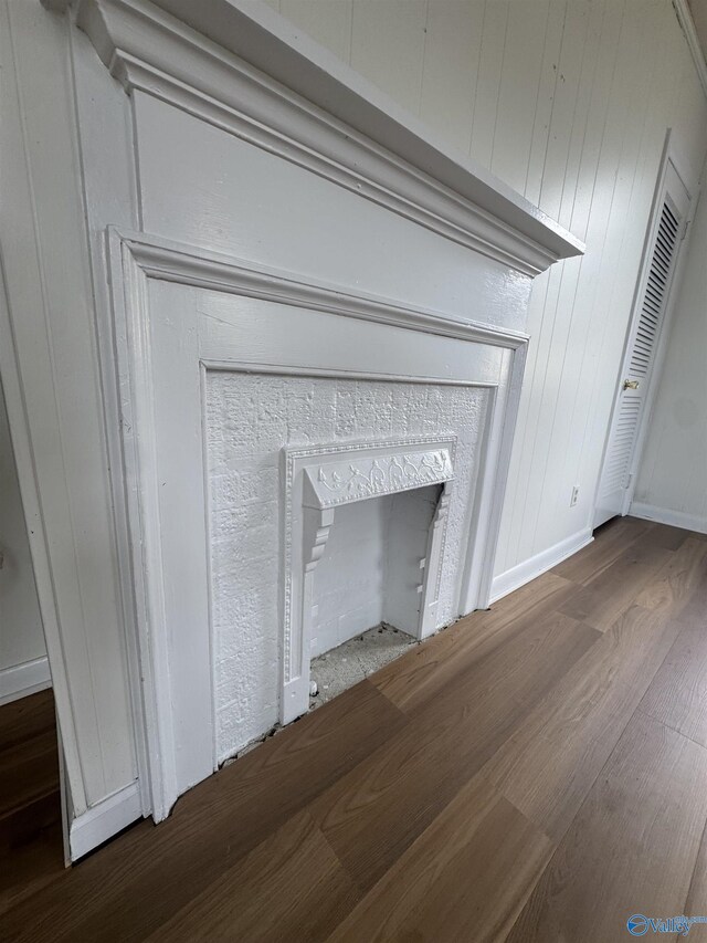 details with baseboards and wood finished floors