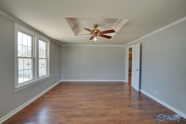 unfurnished room featuring baseboards, visible vents, dark wood finished floors, ceiling fan, and ornamental molding