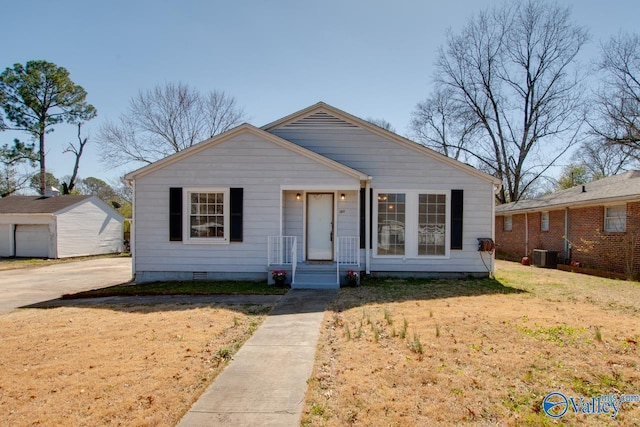 bungalow-style home featuring crawl space, a front lawn, and cooling unit