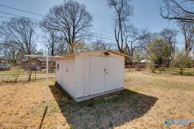 view of shed with fence