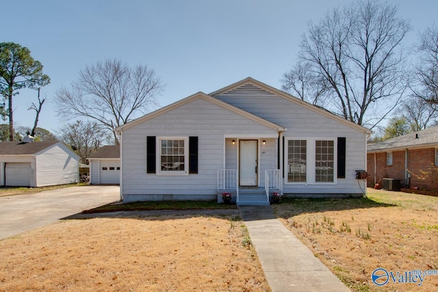 bungalow-style home with crawl space, driveway, and central AC