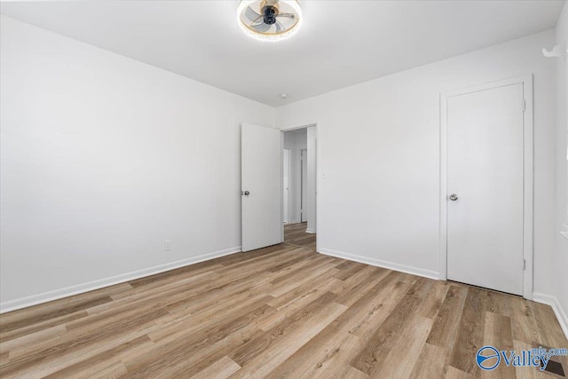 unfurnished bedroom featuring light wood-type flooring