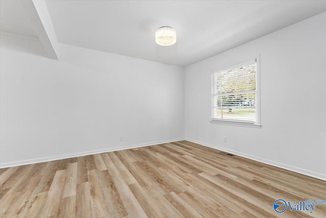 unfurnished room featuring light hardwood / wood-style floors