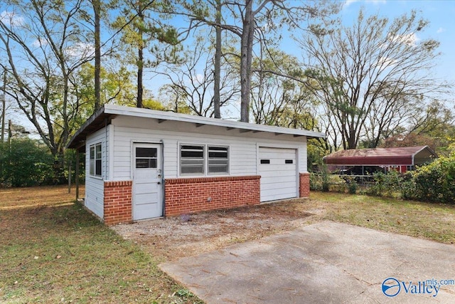 view of outdoor structure with a garage