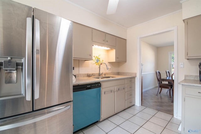 kitchen with sink, crown molding, appliances with stainless steel finishes, tasteful backsplash, and light tile patterned flooring