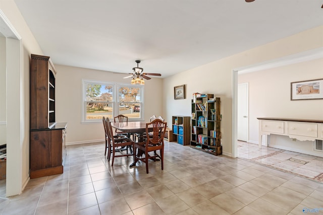 dining area featuring ceiling fan and light tile patterned floors