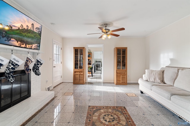 living room featuring crown molding and ceiling fan