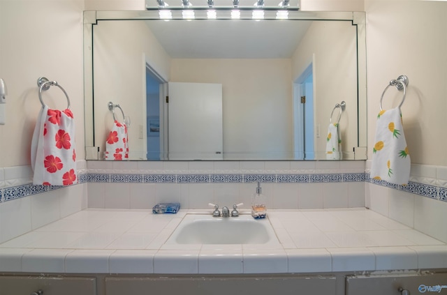 bathroom featuring decorative backsplash and vanity