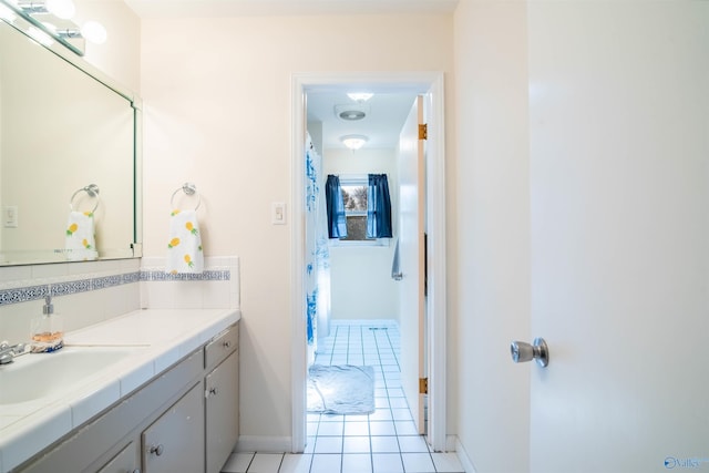 bathroom with tile patterned floors and vanity