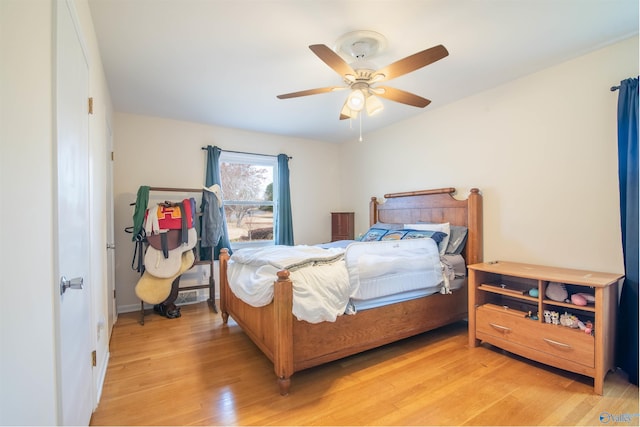 bedroom featuring light wood-type flooring and ceiling fan