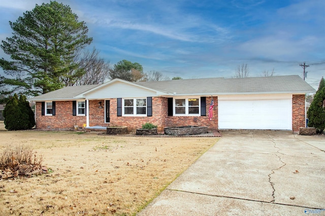 single story home with a garage and a front lawn