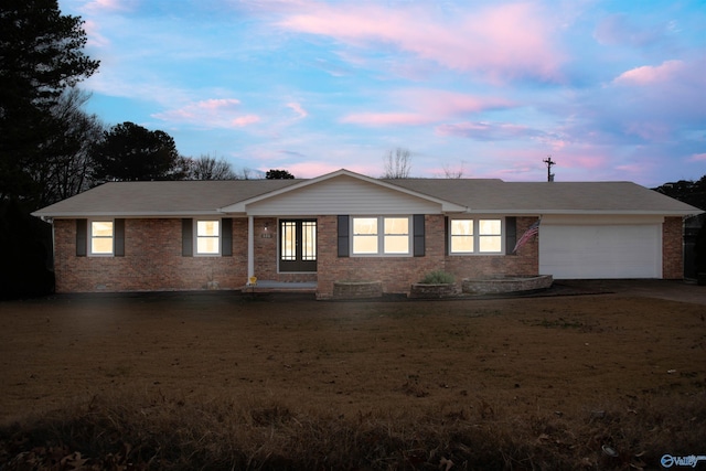 ranch-style house featuring a garage