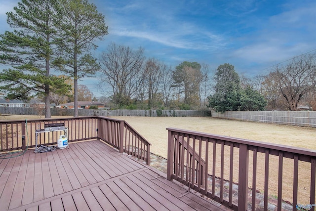 wooden deck with a lawn