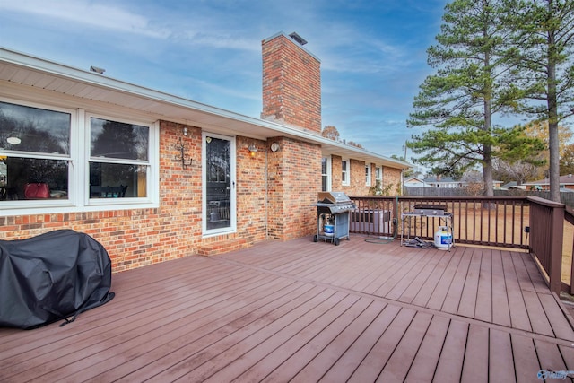 wooden deck with area for grilling