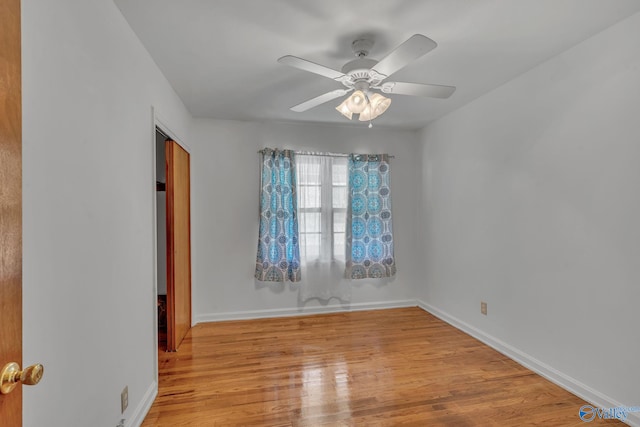 unfurnished room with ceiling fan and light wood-type flooring