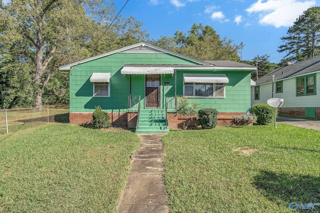 bungalow with a front lawn