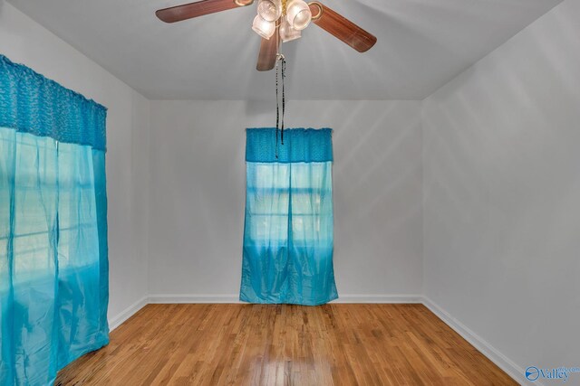 1013 Hermosa Ave, Gadsden, AL 35901 - spare room with wood finished floors, baseboards, and a ceiling fan