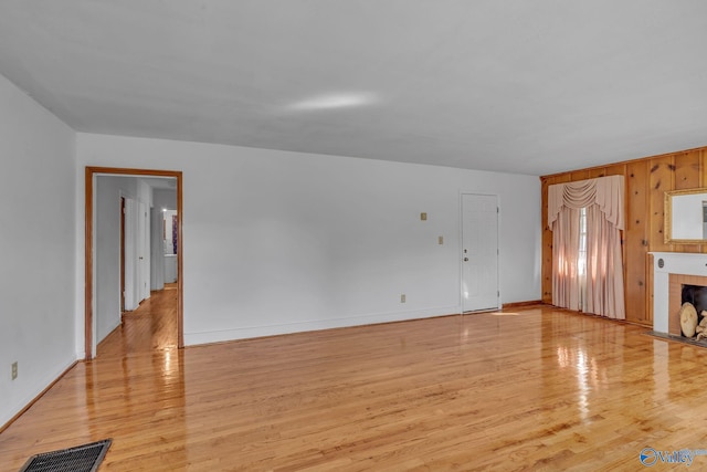 unfurnished living room with light hardwood / wood-style flooring