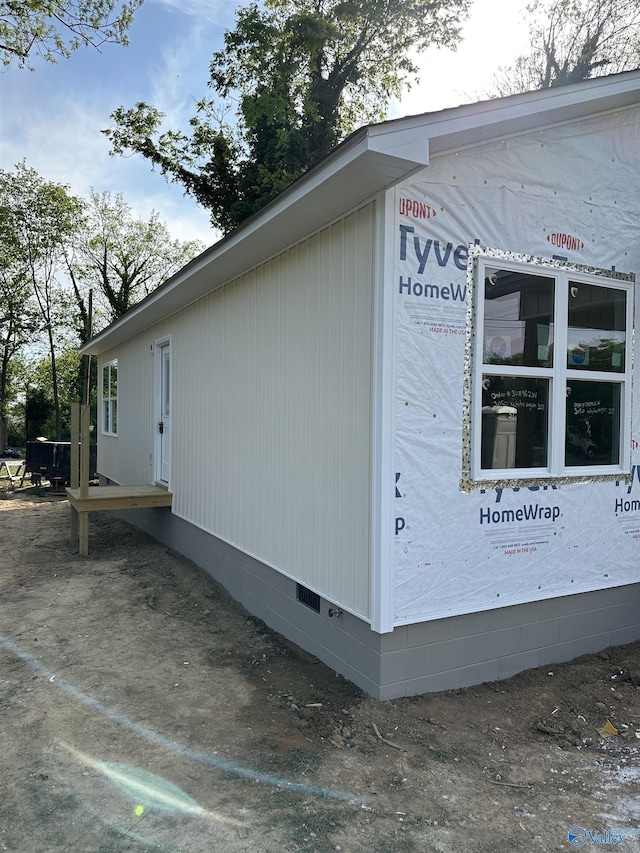 view of side of home with crawl space