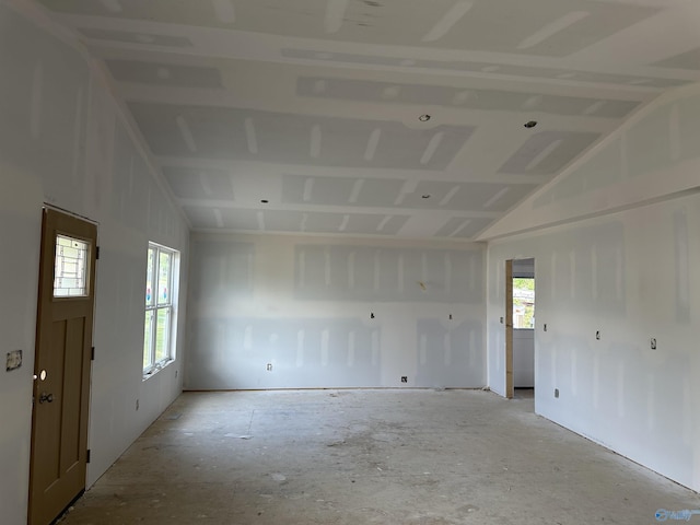 spare room featuring vaulted ceiling