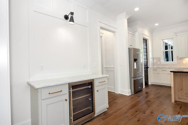 bar with high end fridge, dark wood-style floors, backsplash, wine cooler, and recessed lighting