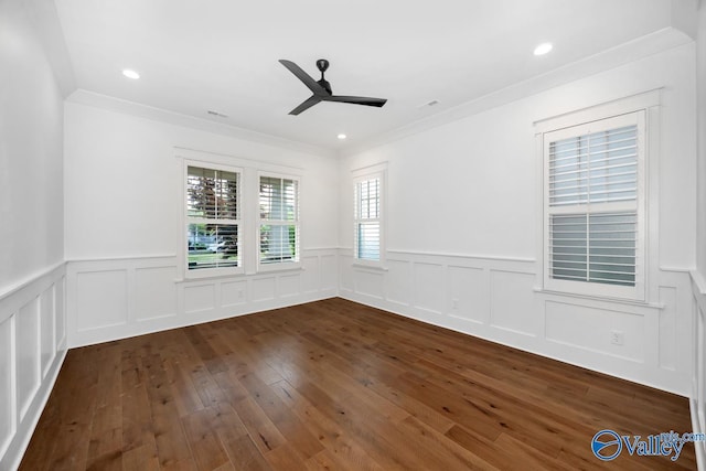 spare room with recessed lighting, wainscoting, ceiling fan, crown molding, and dark wood-style floors