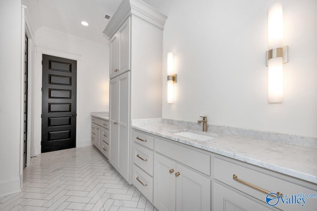 bathroom with vanity and recessed lighting