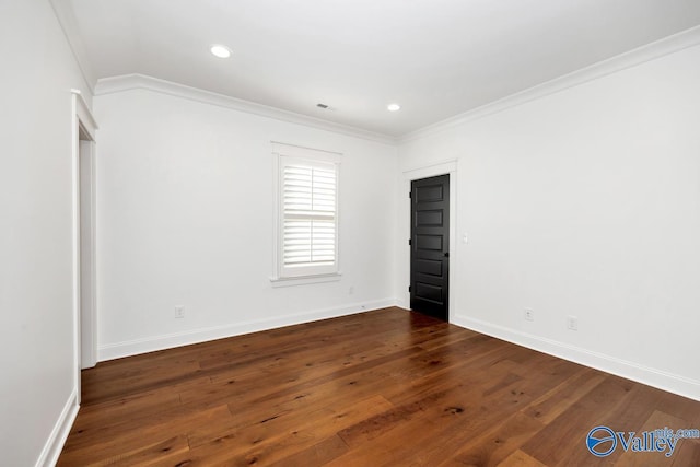 spare room featuring baseboards, recessed lighting, crown molding, and dark wood-type flooring