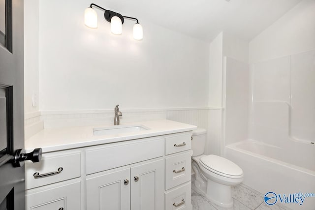 full bath with toilet and vanity