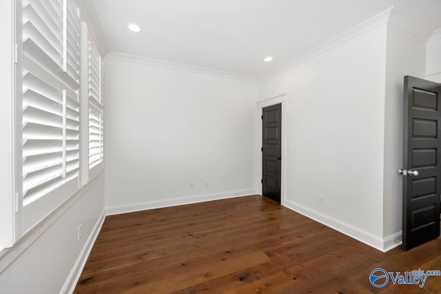 spare room with ornamental molding, baseboards, recessed lighting, and dark wood finished floors