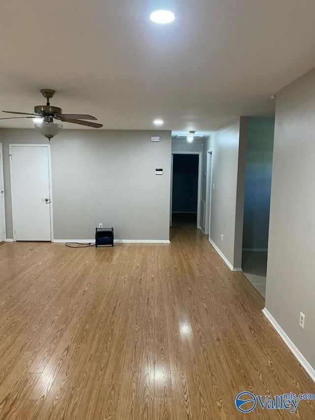 1520 Balch Rd, Madison, AL 35757 - unfurnished living room featuring ceiling fan, wood finished floors, and baseboards
