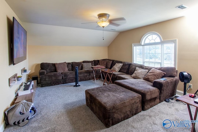 living room with carpet floors, lofted ceiling, and ceiling fan