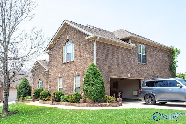 view of front of home with a garage and a front yard