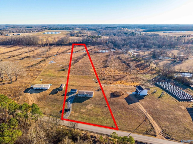 birds eye view of property featuring a rural view