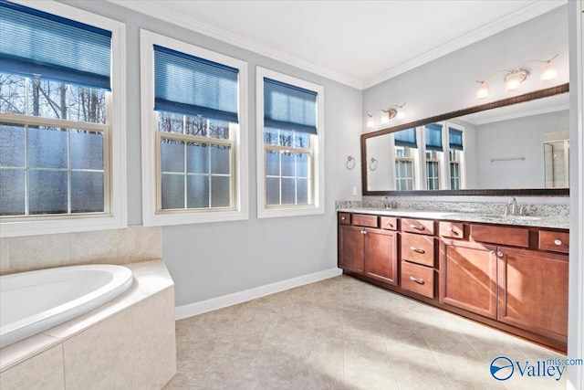 bathroom featuring tile patterned flooring, crown molding, a relaxing tiled tub, and vanity