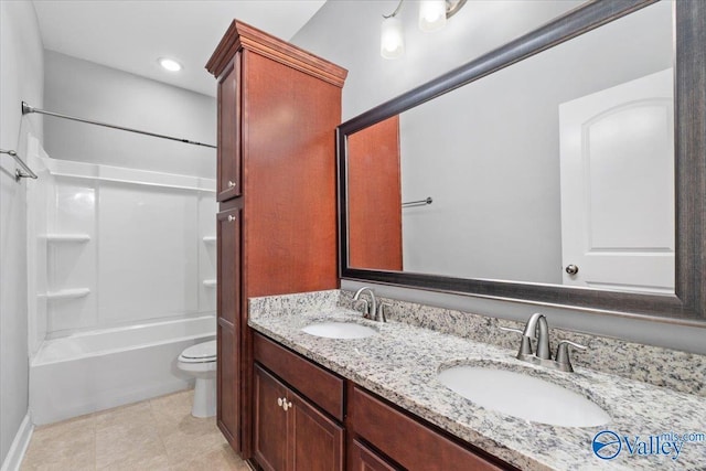 full bathroom with tile patterned flooring, vanity,  shower combination, and toilet