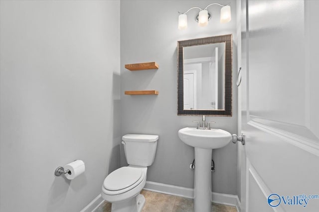 bathroom with sink and toilet