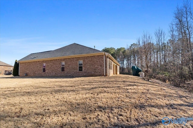 view of property exterior with a lawn